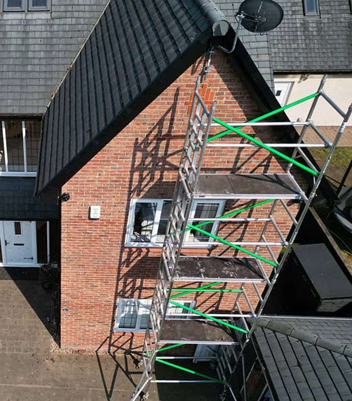 Overhead view of brick building with scaffolding